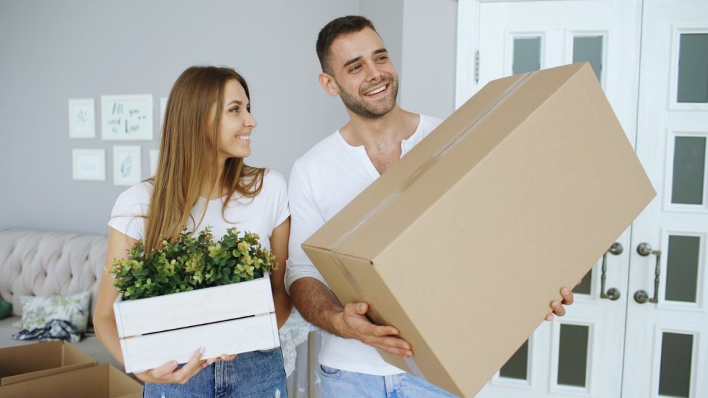 reliable Home Removals, happy couple in new home
